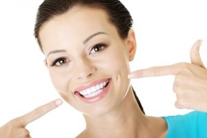 Woman showing her perfect teeth.